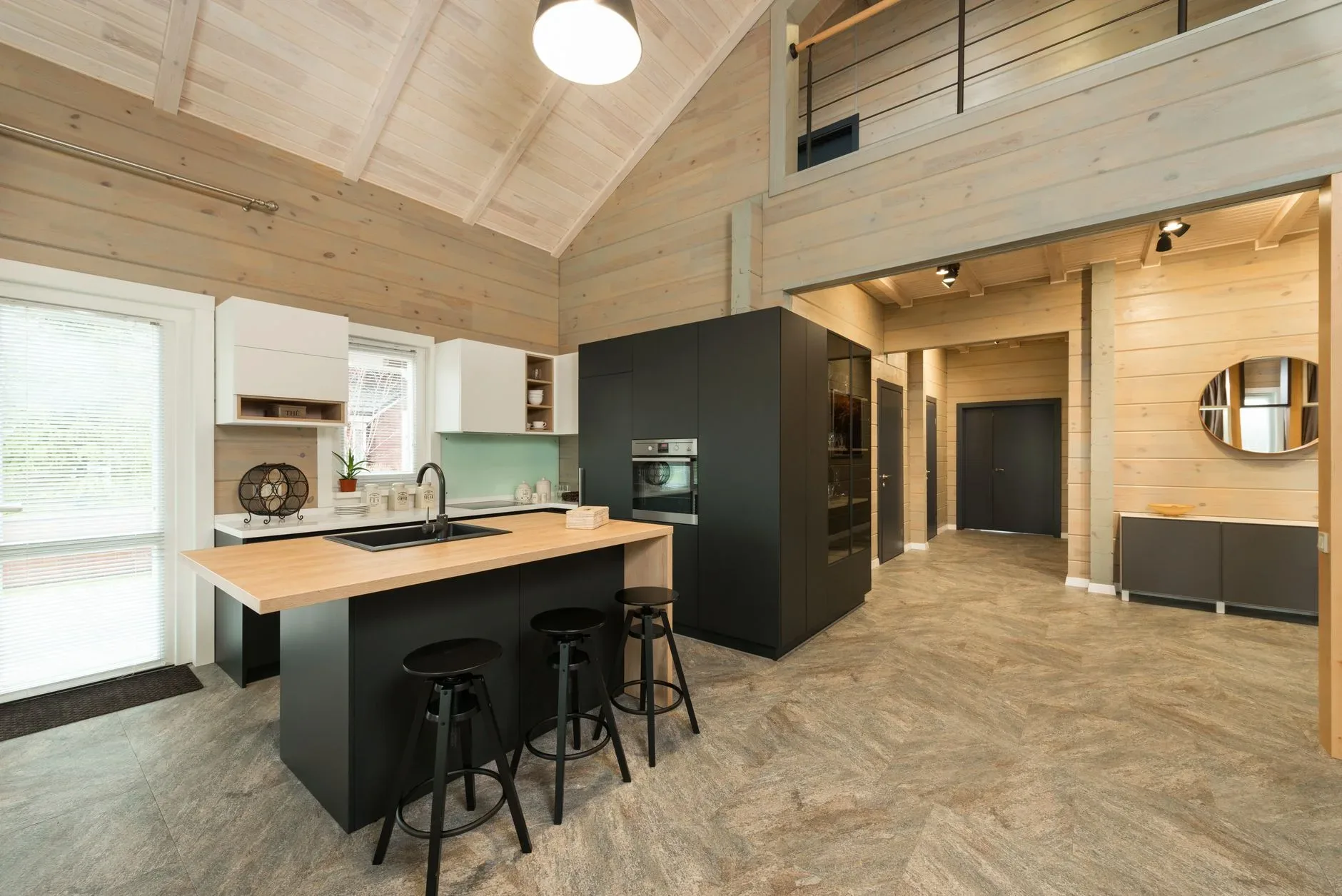 A stylish modern kitchen featuring wooden accents and minimalist design.