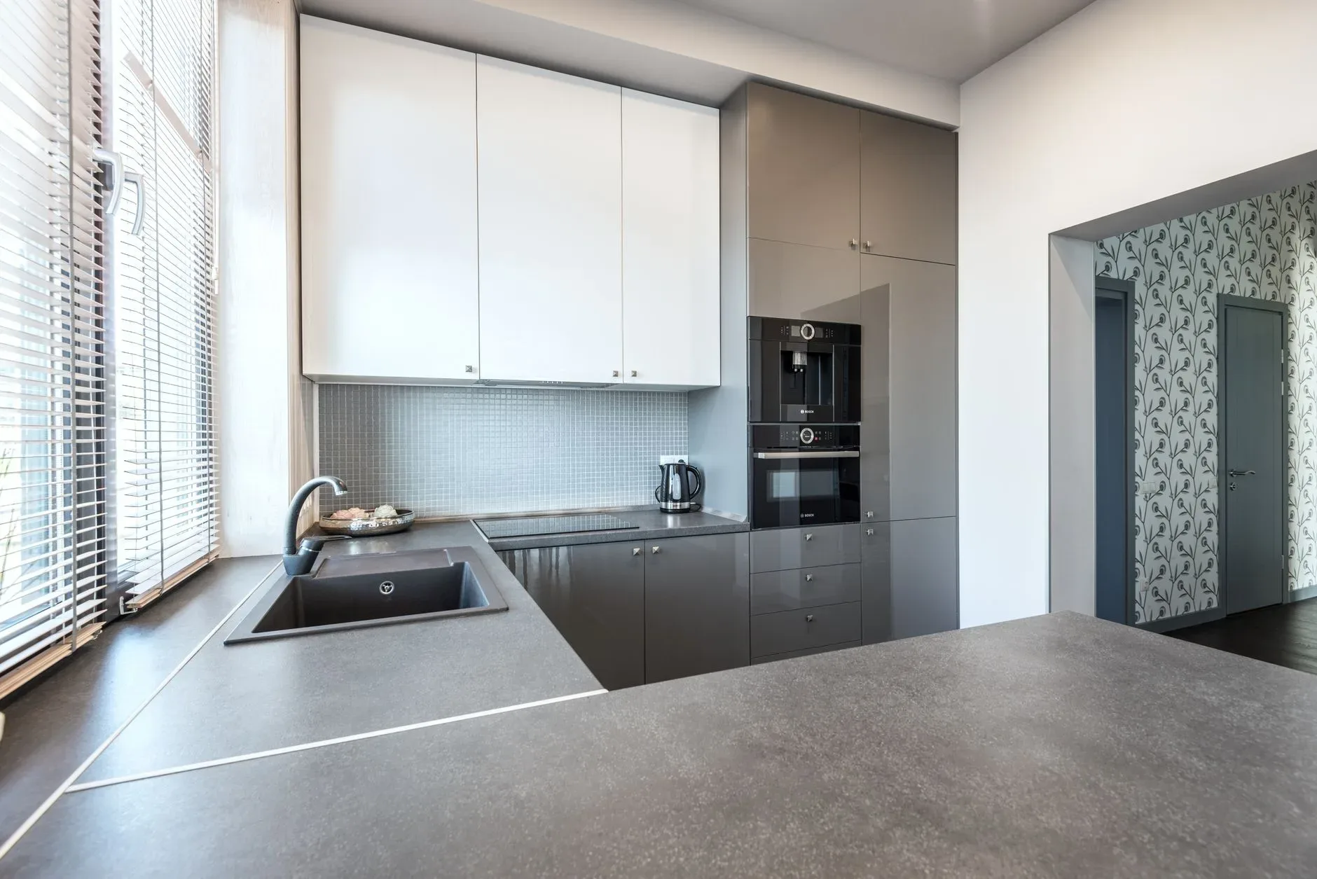 Stylish and sleek modern kitchen interior with high-gloss cabinetry and minimalist design.