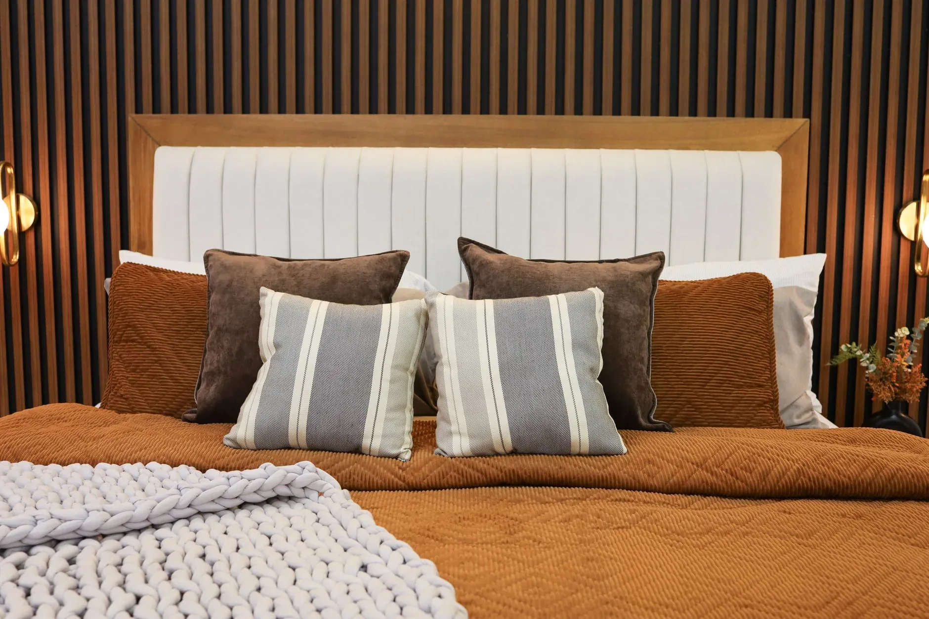 Stylish bedroom with elegant pillows and cozy bedding for a modern aesthetic.