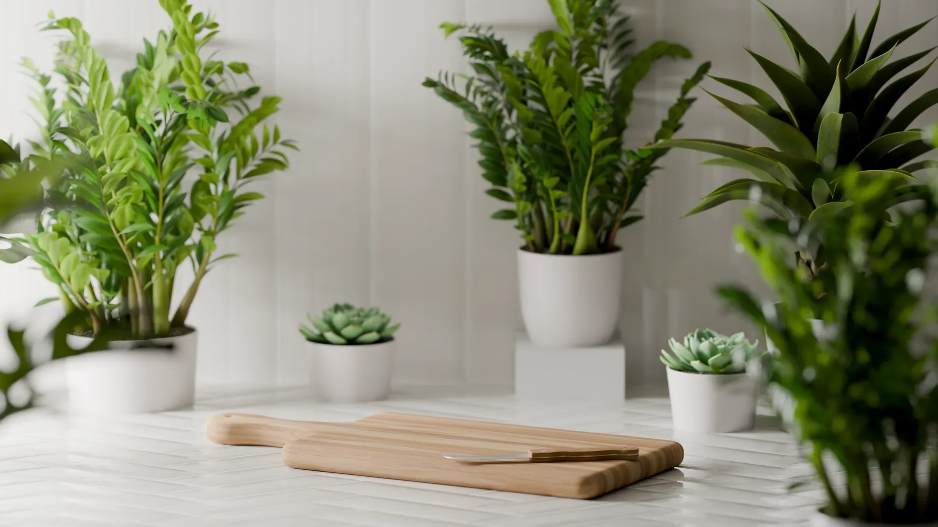 Stylish kitchen setup featuring a wooden cutting board surrounded by lush potted plants and succulents.